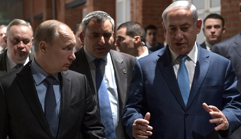 Russian President Vladimir Putin, left, and Israeli Prime Minister Benjamin Netanyahu, right, walk during their meeting marking 75th anniversary of the 75th anniversary of the Sobibor uprising, the only successful uprising that took place in a death camp during World War II at the Jewish Museum and Tolerance Center in Moscow in Moscow, Russia, Monday, Jan. 29, 2018.
