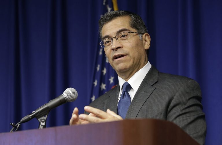 California Attorney General Xavier Becerra speaks at a news conference.