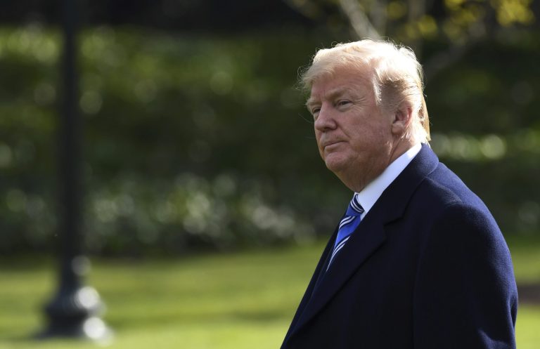 President Donald Trump walks across the South Lawn of the White House in Washington, Friday, March 23, 2018, as he heads to Marine One for a short trip to Andrews Air Force Base. Trump is heading to Florida where he will spend the weekend at the Mar-a-Lago estate.