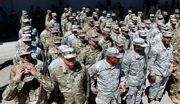 Arizona National Guard soldiers line up as they get ready for a visit from Arizona Gov. Doug Ducey prior their deployment to the Mexico border at the Papago Park Military Reservation Monday, April 9, 2018, in Phoenix. 