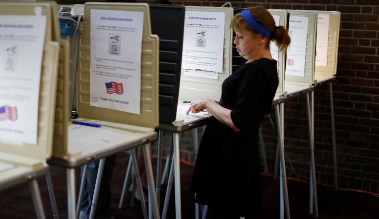 Make Election Day a federal holiday — and one day after Tax Day A voter votes at a local precinct on primary election day in Cincinnati.
