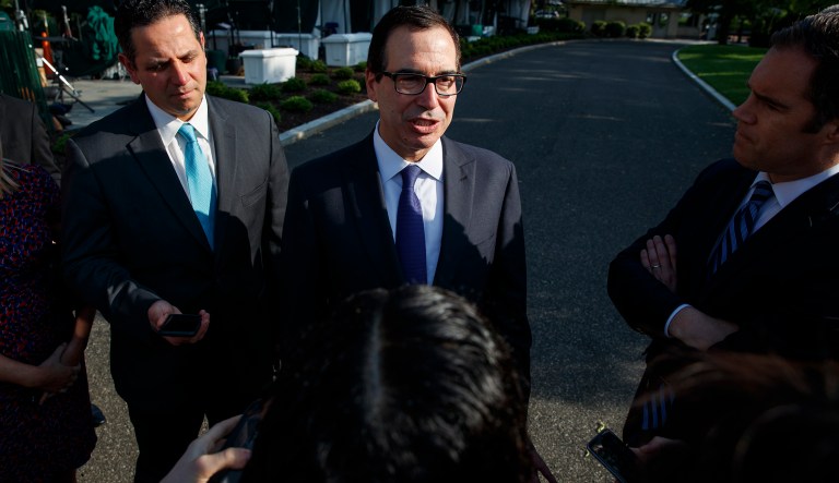 Treasury Secretary Steve Mnuchin talks with reporters about trade with China outside of the White House, Monday, May 21, 2018, in Washington. 