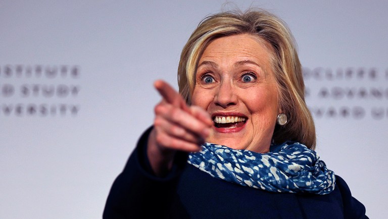 Hillary Clinton points to the audience as she is introduced at Harvard University in Cambridge, Mass., Friday, May 25, 2018. Harvard University's Radcliffe Institute honored Clinton with the 2018 Radcliffe Medal.