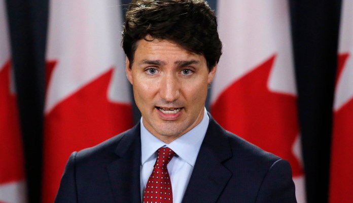 Canadian Prime Minister Justin Trudeau speaks during a news conference in Ottawa, Ontario on Thursday, May 31, 2018. The Trump administration announced Thursday that it will impose tariffs on steel and aluminum imports from Europe, Mexico and Canada. Trudeau said: "These tariffs are totally unacceptable." Canada announced plans to slap tariffs on $16.6-billion Canadian (US$12.8 billion) worth of U.S. products, ranging from steel to yogurt to toilet paper.