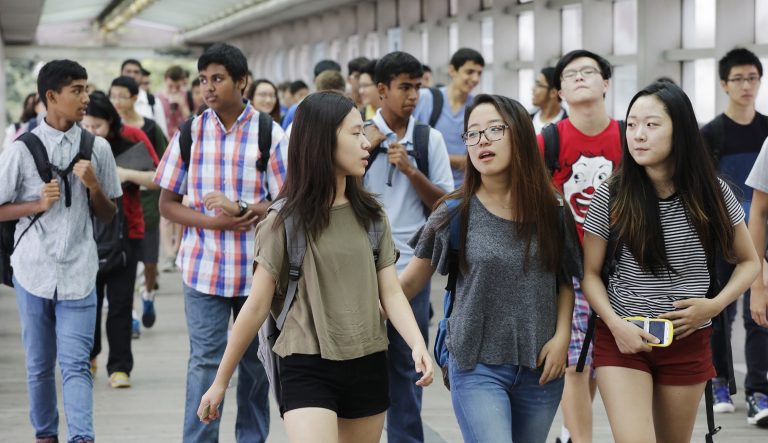FILE - In this Sept. 9, 2015 file photo, students arrive for the first day of school at Stuyvesant High School in New York. A push to diversify New York City's most elite public high schools is facing a backlash from the group that makes up most of the schools' current student bodies: Asian-Americans. 