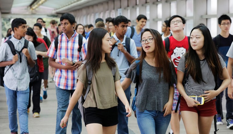 FILE - In this Sept. 9, 2015 file photo, students arrive for the first day of school at Stuyvesant High School in New York. A push to diversify New York City's most elite public high schools is facing a backlash from the group that makes up most of the schools' current student bodies: Asian-Americans. 