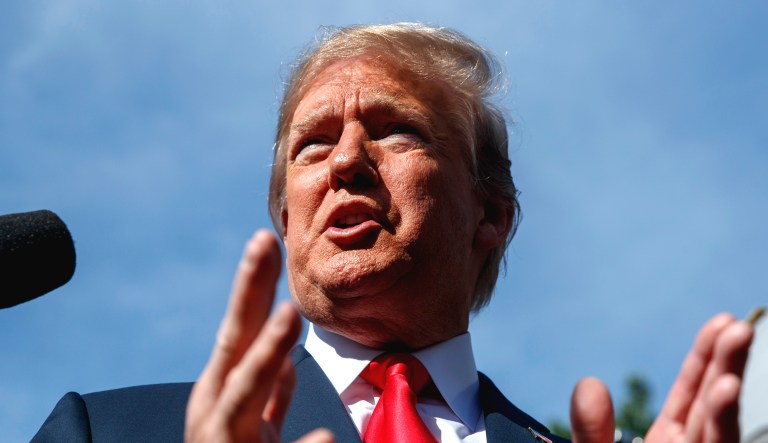 President Trump speaks to reporters at the White House in Washington.