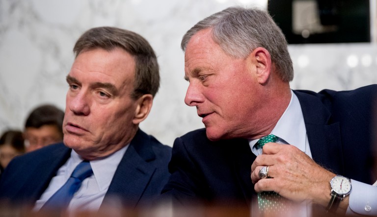 Senate Intelligence Chairman Richard Burr, R-N.C., speaks with Committee Vice Chairman Mark Warner, D-Va., during a panel hearing on June 20, 2018, in Washington.