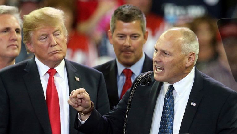 President Trump, left, listens as Republican Pete Stauber addresses the crowd in his run for Minnesota's 8th Congressional District.
