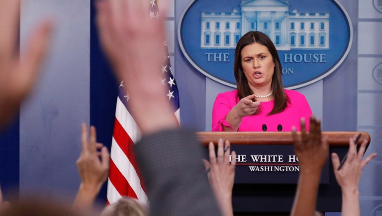 White House press secretary Sarah Huckabee Sanders points as she fields questions from members of the media during the daily briefing in the Brady Press Briefing Room of the White House, Monday, June 25, 2018.