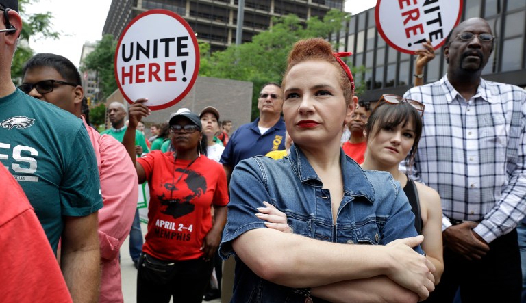 In this Wednesday June 27, 2018 file photo, a Democratic party activist dressed as Rosie the Riveter attends a protest by Philadelphia Council AFL-CIO in Philadelphia.