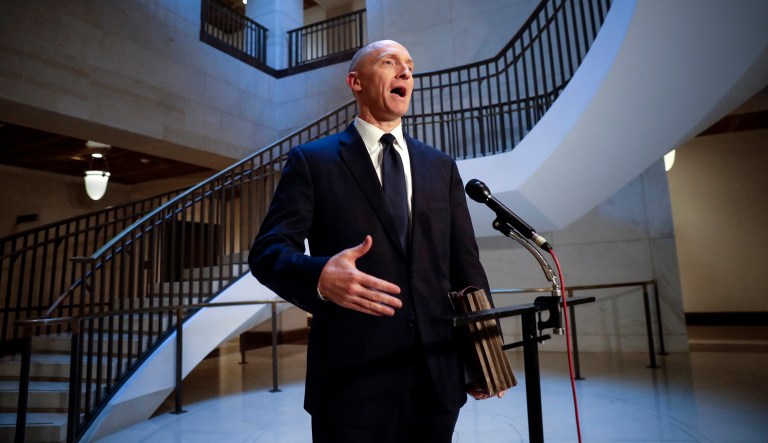 Carter Page, a foreign policy adviser to Trump's 2016 presidential campaign, speaks with reporters.