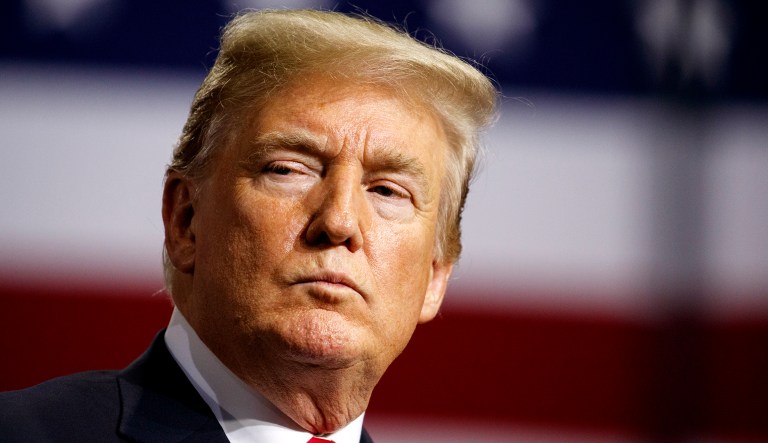 President Trump listens during a campaign rally at Florida State Fairgrounds Expo Hall on Tuesday in Tampa, Fla. 
