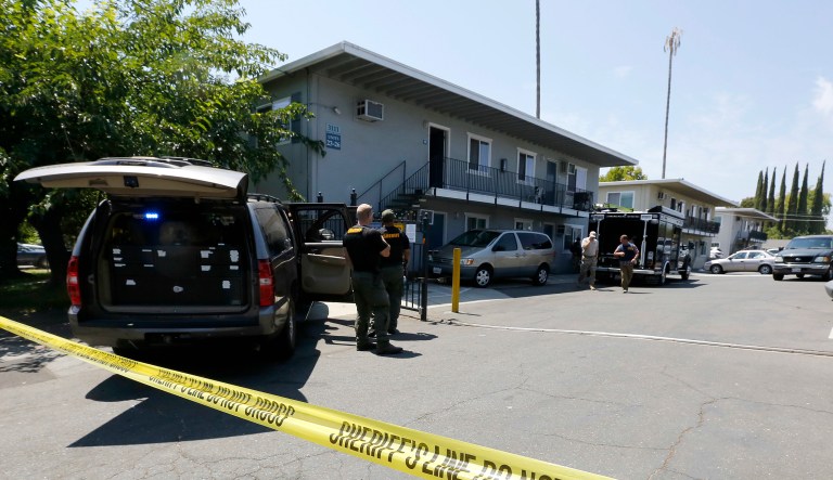 Crime scene tape blocks the entrance to an apartment complex following the arrest of a 45-year-old Iraqi refugee, Omar Ameen, on Wednesday in Sacramento, Calif. Ameen was arrested on a warrant alleging that he killed an Iraqi policeman in 2014 while serving with the Islamic State terror organization.