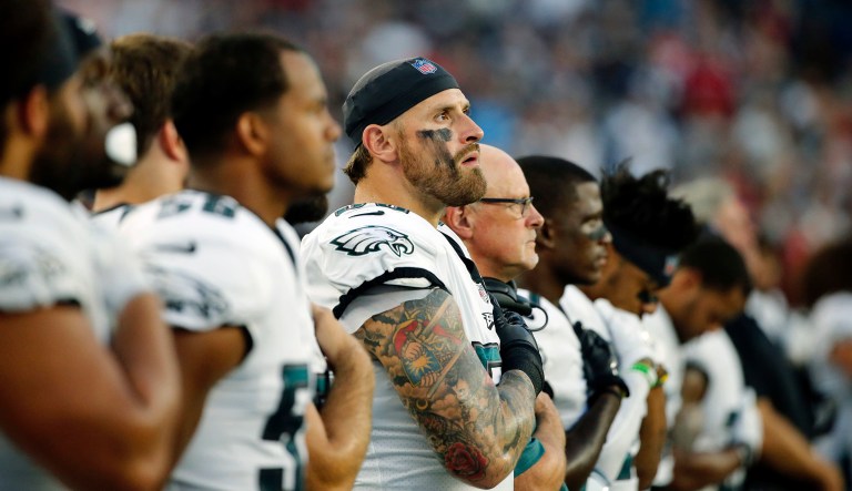 Philadelphia Eagles players stand for the national anthem before a preseason NFL football game against the New England Patriots on Aug. 16, 2018, in Foxborough, Mass.
