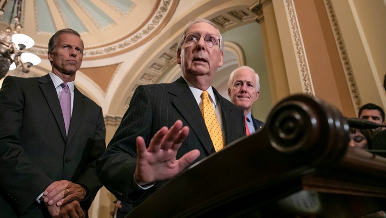 Senate Majority Leader Mitch McConnell, R-Ky., flanked by Sen. John Thune, R-S.D., left, and Majority Whip John Cornyn, R-Texas, speaks with reporters following their weekly policy meetings.