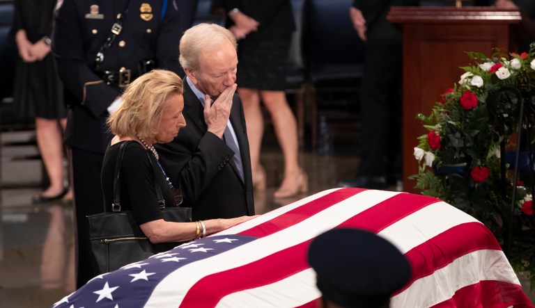 Sen. Joe Lieberman, right, and his wife Hadassah Lieberman, pay their respects at the flag-draped casket of Sen. John McCain of Arizona, who lived and worked in Congress over four decades, in the U.S. Capitol rotunda, Friday, Aug. 31, 2018, in Washington. McCain was a six-term senator, a former Republican nominee for president, and a Navy pilot who served in Vietnam, where he endured five-and-a-half years as a prisoner of war. He died Aug. 25 from brain cancer at age 81.