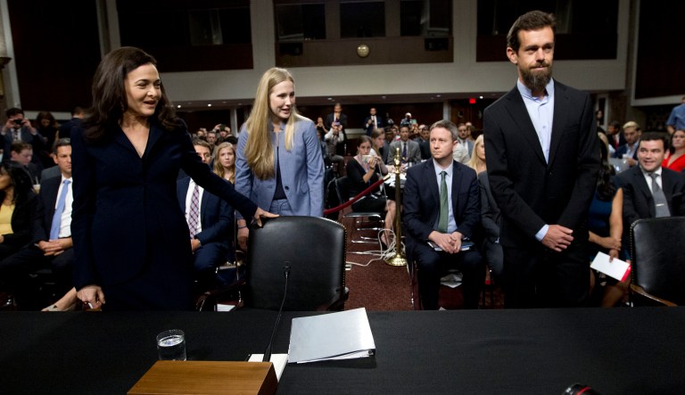 Facebook COO Sheryl Sandberg, left, accompanied byTwitter CEO Jack Dorsey arrive to the Senate Intelligence Committee hearing on 'Foreign Influence Operations and Their Use of Social Media Platforms' on Capitol Hill, Wednesday, Sept. 5, 2018, in Washington.