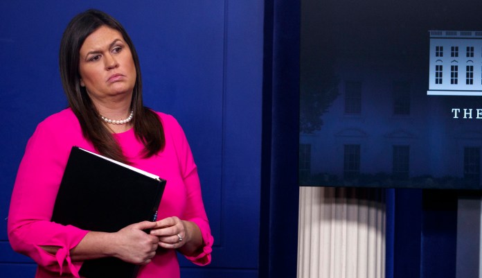 White House press secretary Sarah Sanders listens during the daily press briefing at the White House, Sept. 10, 2018, in Washington.