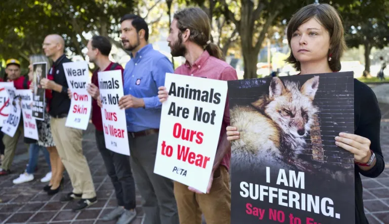 Emily Rohr, right, joins fur ban protesters with the People for the Ethical Treatment of Animals (PETA) prior to a news conference at Los Angeles City.