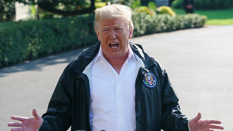 President Trump talks to media before boarding Marine One on the South Lawn of the White House.