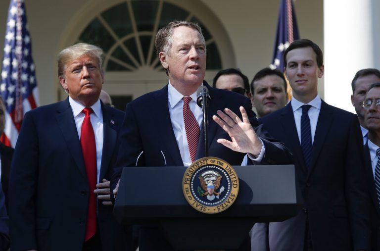 U.S. Trade Representative Ambassador Robert Lighthizer, center, gestures while speaking after President Donald Trump, left, announced a revamped North American free trade deal, in the Rose Garden of the White House in Washington, Monday, Oct. 1, 2018. Also on stage is White House Senior Adviser Jared Kushner, right.