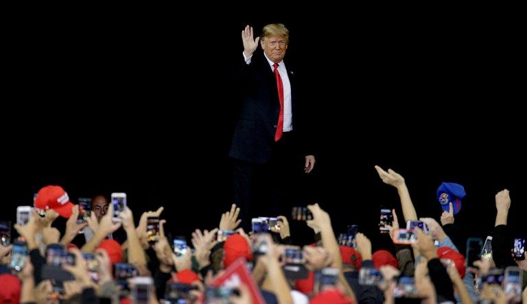President Trump greets the crowd during a campaign rally Saturday in Topeka, Kan. 