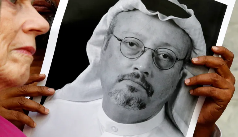 People hold signs during a protest at the Embassy of Saudi Arabia about the disappearance of Saudi journalist Jamal Khashoggi, Wednesday, Oct. 10, 2018, in Washington.