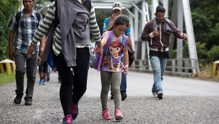 Honduran migrants walk in a group toward the U.S. as they make their way through Chiquimula, Guatemala.
