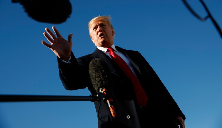 President Donald Trump talks to reporters as before boarding Air Force One, Thursday, Oct. 18, 2018, in Andrews Air Force Base, Md., en route to campaign stops in Montana, Arizona and Nevada.