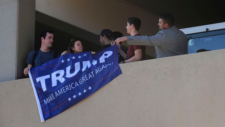 A group of Trump supporters is asked to leave as Sen. Bernie Sanders campaigns for Nevada Democrats on the University of Nevada, Reno campus.