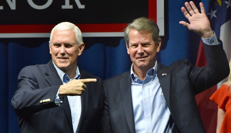 Vice President Mike Pence, left, and GOP gubernatorial candidate Brian Kemp, right, wave to supporters at Dalton Convention Center in Dalton on Thursday, Nov. 1, 2018. Kemp is trying to extend the Republican domination in Georgia, which hasn't elected a Democrat as governor since 1998. He's banking on running up wide margins outside metro Atlanta and holding most of the GOP votes closer to the city.