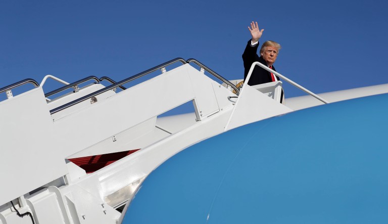President Donald Trump boards Air Force One for campaign rallies in Georgia and Tennessee, Sunday, Nov. 4, 2018, in Andrews Air Force Base, Md.