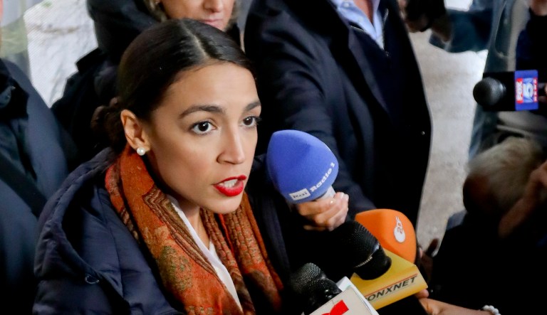 New York Democratic congressional candidate Alexandria Ocasio-Cortez speaks with reporters after voting on Tuesday in the Parkchester community of the Bronx, N.Y. 