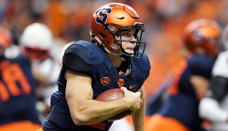 In this Nov. 9, 2018, file photo, Syracuse quarterback Eric Dungey runs with the ball during the first half of an NCAA college football game against Louisville in Syracuse, N.Y.