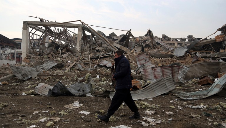 An Afghan security force member walks at the site of suicide bomb attack in Kabul, Afghanistan, in this 2018 file photograph.