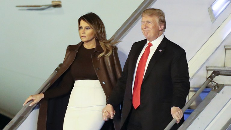 President Trump and first lady Melania Trump walk from Air Force One.