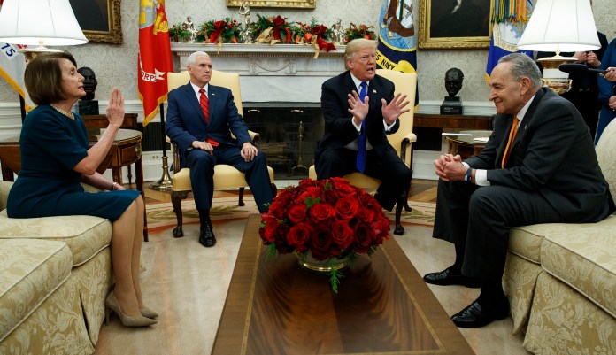 House Minority Leader Rep. Nancy Pelosi, D-Calif., Vice President Mike Pence, President Donald Trump, and Senate Minority Leader Chuck Schumer, D-N.Y., argue during a meeting in the Oval Office of the White House, Tuesday, Dec. 11, 2018, in Washington.