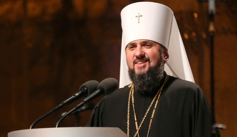 A new head of independent Ukrainian church Metropolitan of Kiev Epiphanius greets people gathered to support independent Ukrainian church near the St. Sophia Cathedral in Kiev, Ukraine, on Saturday.