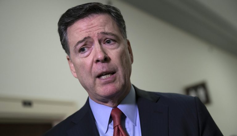 Former FBI Director James Comey speaks to reporters on Capitol Hill Washington, Monday, Dec. 17, 2018.