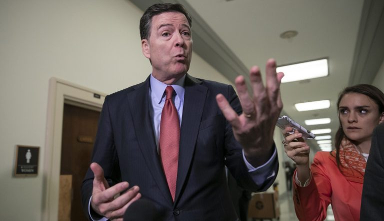 Former FBI Director James Comey speaks to reporters on Capitol Hill Washington, Monday, Dec. 17, 2018.