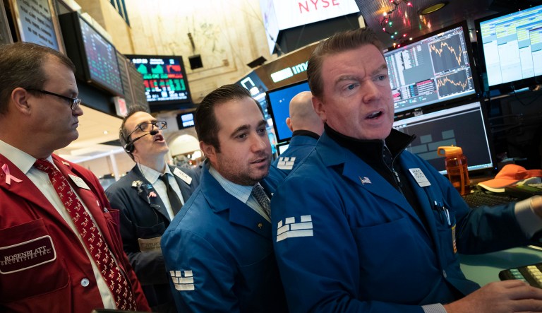Stock traders work at the New York Stock Exchange, Wednesday, Dec. 19, 2018. 