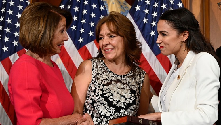 House Speaker Nancy Pelosi of Calif., left, talks with Rep. Alexandria Ocasio-Cortez, D-N.Y., right.