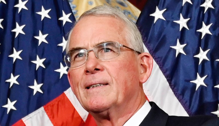 House Speaker Nancy Pelosi of Calif., second from left, poses during a ceremonial swearing-in with Rep. Francis Rooney, R-Fla., right, on Capitol Hill in D.C.