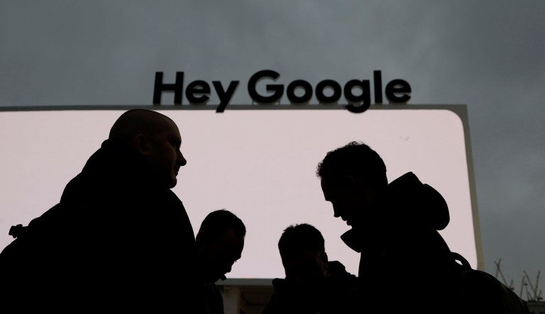 People stand in front of the Google tent during preparations for CES International, Saturday, Jan. 5, 2019, in Las Vegas.
