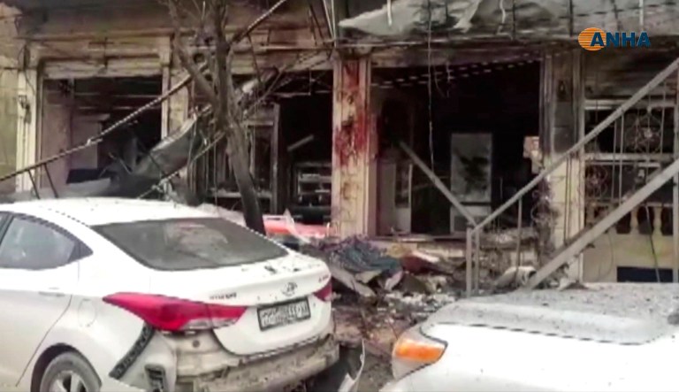 This frame grab from video provided by Hawar News, ANHA, the news agency for the semi-autonomous Kurdish areas in Syria, shows a damaged restaurant where an explosion occurred, in Manbij, Syria, Wednesday, Jan. 16, 2019. The Britain-based Syrian Observatory for Human Rights, a Syrian war monitoring group, and a local town council said Wednesday that the explosion took place near a patrol of the U.S.-led coalition and that there are casualties.