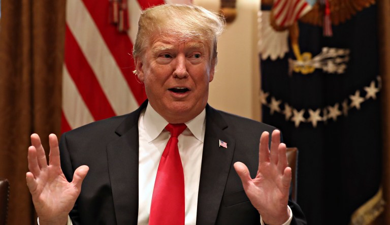 President Trump gestures while speaking about tariffs, Thursday, Jan. 24, 2019, in the Cabinet Room of the White House in Washington.