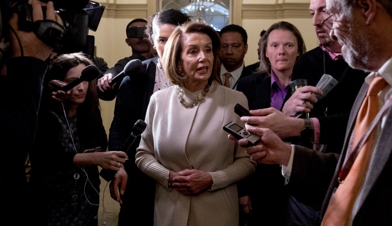 House Speaker Nancy Pelosi of California speaks to members of the media as she arrives on Capitol Hill in Washington, Friday, Jan. 25, 2019. Pelosi answered questions about the indictment of longtime Donald Trump associate Roger Stone.