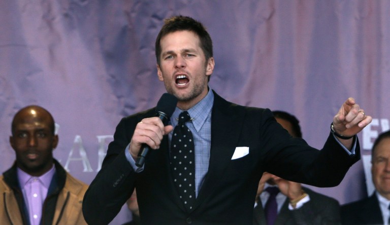 New England Patriots quarterback Tom Brady, center, addresses the crowd.