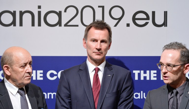 German Foreign Minister Heiko Maas, right, French Foreign Minister Jean-Yves Le Drian, left, and Jeremy Hunt United Kingdom's Secretary of State for Foreign and Commonwealth Affairs, stand during statements at a Gymnich meeting of EU foreign ministers in Bucharest, Romania, Thursday, Jan. 31, 2019.